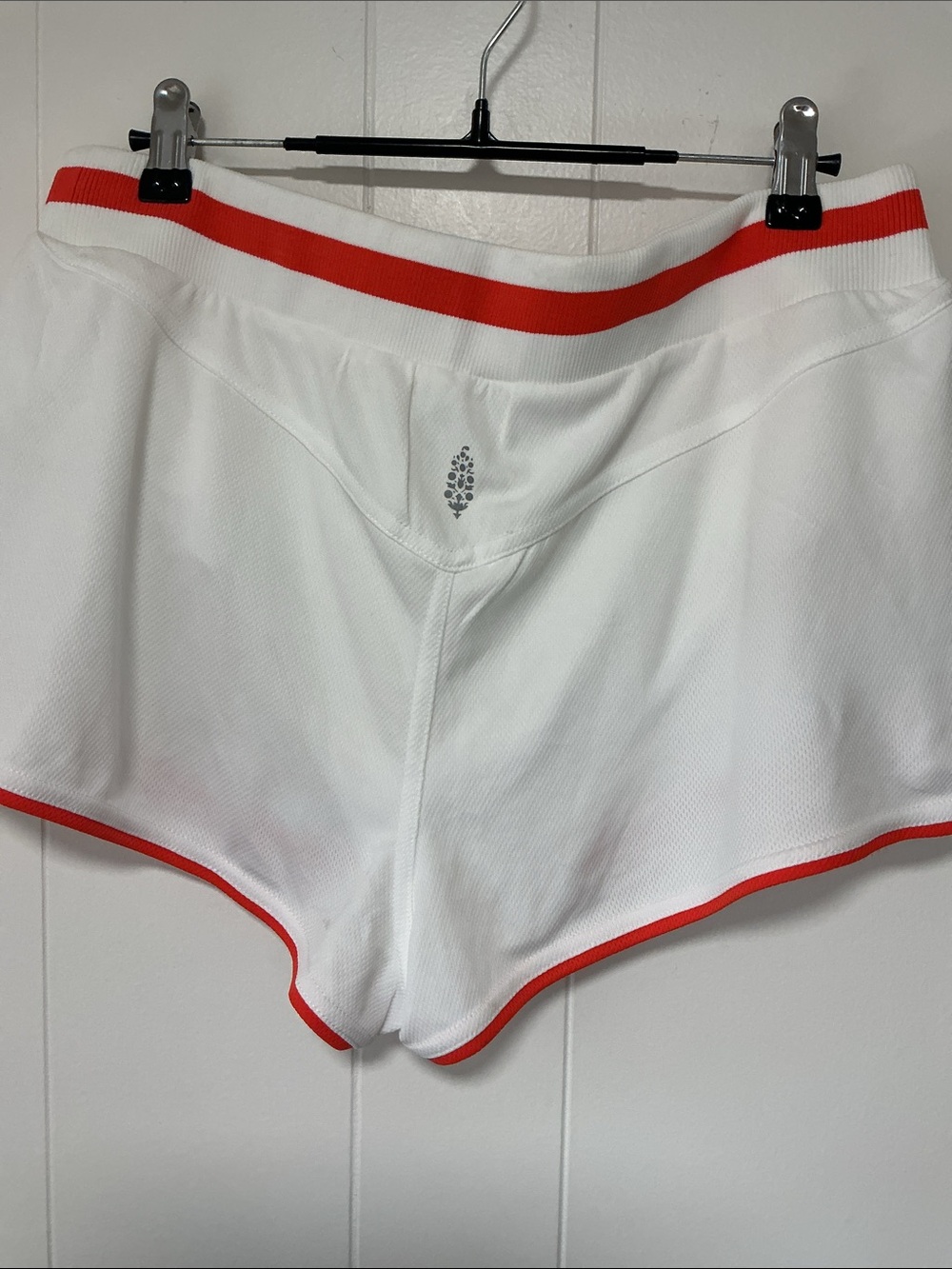 Free people movement; white shorts with red piping. - Picture 2 of 2